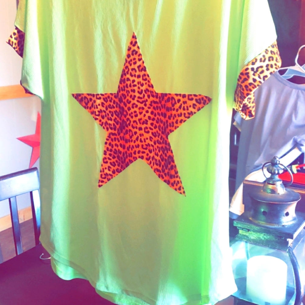 Neon green shirt with cheeta star and cheeta  trim on arms